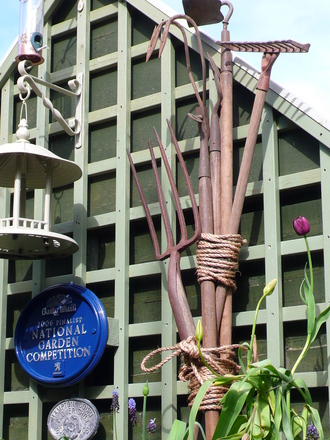 A sculpture made from old garden tools.