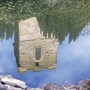 Reflection of chuch tower in pond.