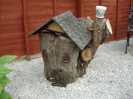 .S-in-L Gdn.  One conifer stump disguessed