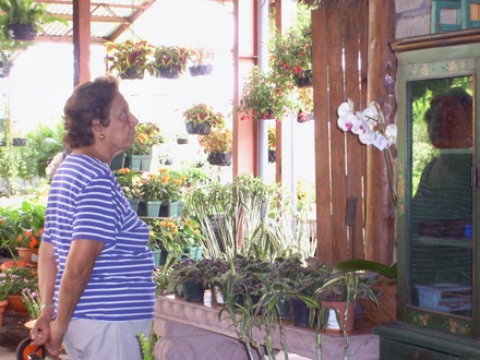 My mother admiring an orchid 