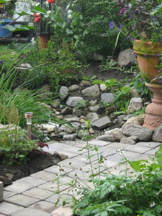 pavers down...patina on the planter...rockslide filling in