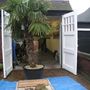 Palm_tree_standing_front_garage